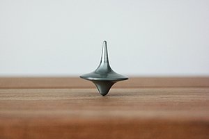 Symbol photo: Spinning top on a wooden surface